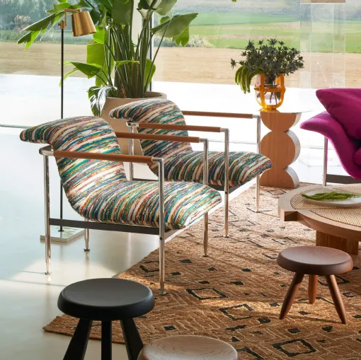 Poltroncina di design in tessuto Esosoft di Cassina