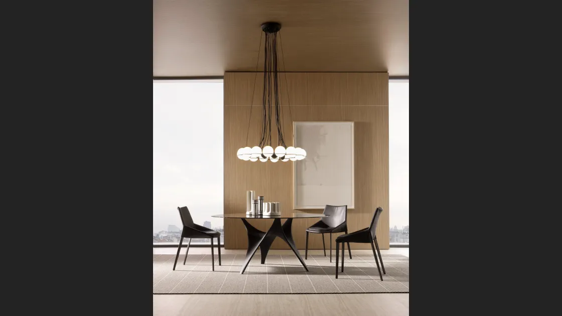 Tavolo rotondo con top in Vetro e base scultorea in Cemento Bronzo Arc di Molteni & C